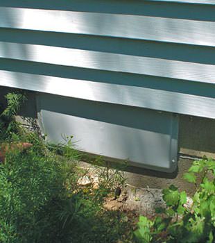 A gray crawl space vent cover in Manotick