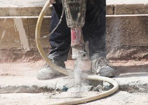 Jackhammering a slab floor in a Carleton Place home.