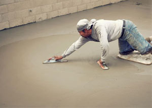 smoothing out the grout in a slab releveling project in Smiths Falls