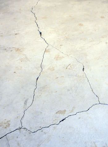 severely cracked, heaving slab floors in a home in Russell