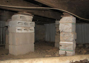crawl space repairs done with concrete cinder blocks and wood shims in a Prescott home