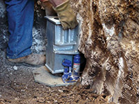 Securing a foundation footing bracket for a foundation repair system in Rockland.