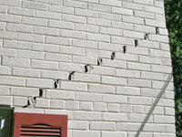 Stair-step cracks showing in a home foundation in Elizabethtown