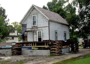A severely damaged home foundation that is undergoing replacement in Cumberland.
