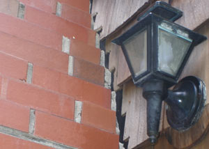 A tilting chimney in Manotick showing serious foundation damage.