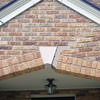 Major tuckpointing on a home archway over a door, with tuckpointing several inches wide that has failed on a Ottawa home