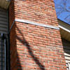 A tilting chimney on a Oxford Mills home with a leaning, tilting chimney that was temporarily repaired.