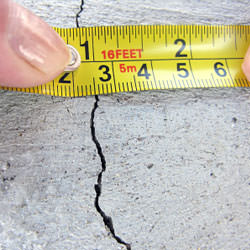 A crack in a poured concrete wall that's showing a normal crack during curing in Embrun