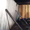 Temporary foundation wall supports stabilizing a Gloucester home
