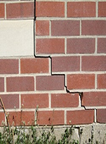 photo of a rotating foundation wall with cracks in Edwards