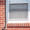 A gap in a window along the outer wall due to foundation settlement of a Greely home.