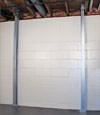 A steel i-beam system installed on a Lancaster foundation wall