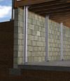 I-beam foundation wall supports installed in a Oxford Mills basement.