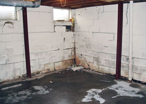 A failed, rusty i-beam foundation wall system installed in Edwards.