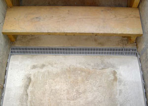 Our grated drain system installed on a leaking basement staircase in Edwards.