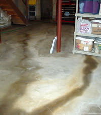 Flooding entering a basement through a floor crack in Winchester