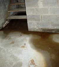 Flooding floor cracks by a hatchway door in Lancaster