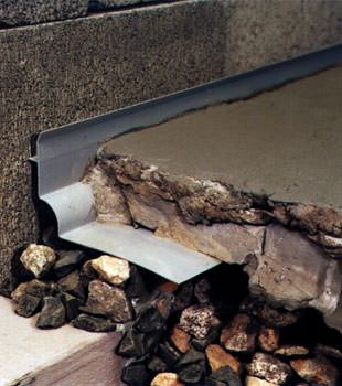 a custom designed basement drain system for thin basement floors in Cumberland.