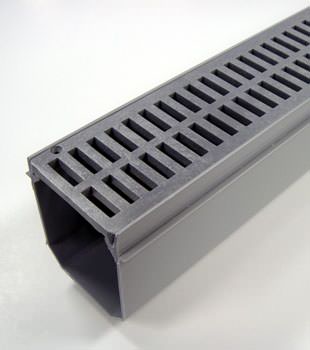 A closeup of our grated basement drainage pipe system, installed in Prescott
